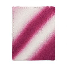 a pink and white striped cloth on a white background