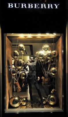 a window display with many shiny objects in it