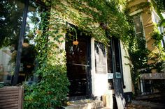 an old building covered in vines and ivys