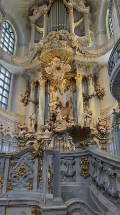 an ornately decorated church with gold and white decorations