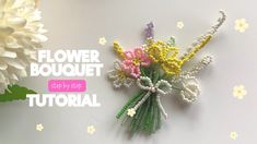 a flower bouquet made out of beads on a white surface with flowers in the background