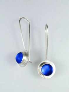 Art Glass & Silver Earrings - Simply modern, these 9mm frosted glass cabochons have an ethereal, colored glow as they swing on long French ear wires. Handmade bezels of recycled sterling and fine silver. Clear rubber earring stoppers are included. Modern Sterling Silver Earrings With Cabochon, Blue Fusion Style Round Earrings, Modern Blue Long Drop Jewelry, Modern Blue Long Drop Earrings, Blue Cabochon Sterling Silver Earrings, Modern Blue Sterling Silver Earrings, Contemporary Blue Sterling Silver Jewelry, Silver Smithing Jewelry, Silversmith Jewelry