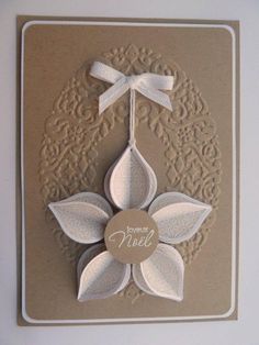 a card with a white flower on it