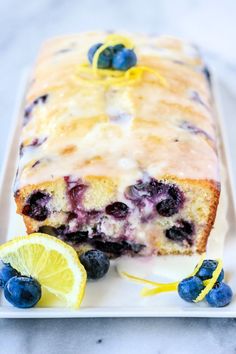 a lemon blueberry loaf cake on a white plate