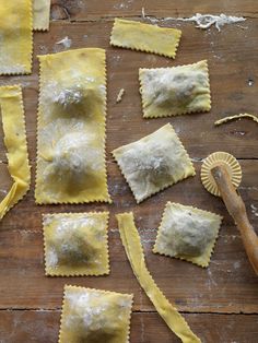 several different types of ravioli on a wooden table