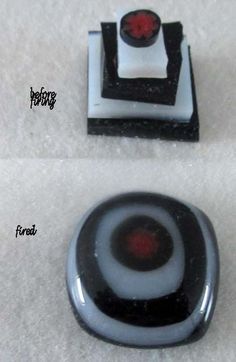 two pieces of black and white glass with red accents