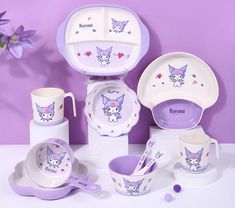 a purple and white kitty themed dinner set