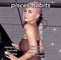 a woman with pink hair is standing in front of a poster that says pisces habitts