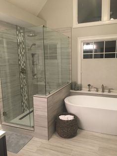 a bathroom with a tub, sink and toilet in it's corner shower stall