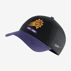 a black and purple hat with the lakers logo on it