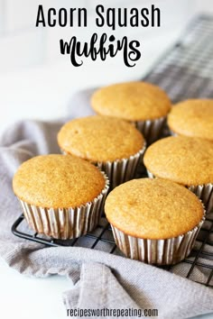 muffins cooling on a wire rack with the words acorn squash muffins