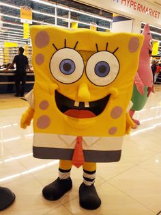 a spongebob mascot standing in the middle of a mall