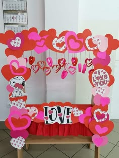 a valentine's day decoration with hearts and love signs