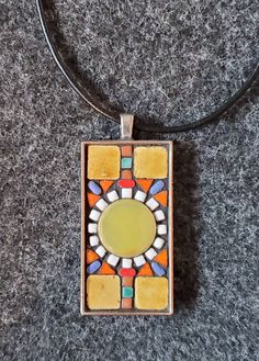 Beautiful tiny ceramic tiles & beads   adorn this charming colorful mosaic pendant set in a metal silver plate rectangular base.  Cord approximately 18" long.  See photo for size.   * All designs exclusive to Nikki Sullivan Mosaics * Micro Mosaic Jewelry Tutorial, Micro Mosaic Ring, Mosaic Tiles Diy, Mosaic Pendant Necklace, Mosaic Necklace, Tiles Diy, Glass Fusion Jewelry Pendant Necklace, Colorful Mosaic, Micro Mosaic Jewelry