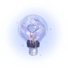 a light bulb with a heart shaped decoration on it's top and flowers in the bottom