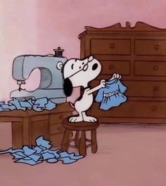 a cartoon dog standing in front of a sewing machine and pile of blue paper on the floor