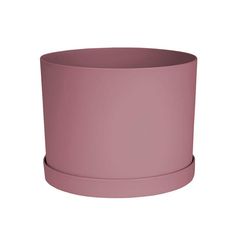 a pink planter sitting on top of a white surface