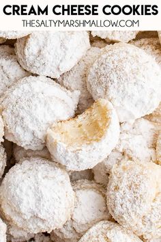 a pile of powdered sugar cookies with the words cream cheese cookies on top and bottom