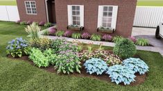 a house with landscaping in front of it and flowers on the lawn next to it