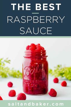 raspberry sauce in a mason jar with fresh raspberries on the side