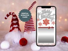 an iphone case with two gnomes and snowflakes on it, next to a christmas card