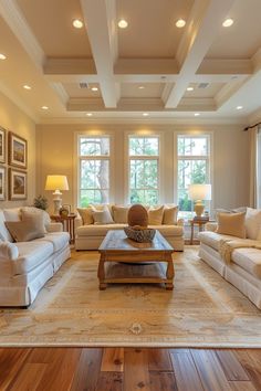 a living room with couches, tables and lamps in it's center area