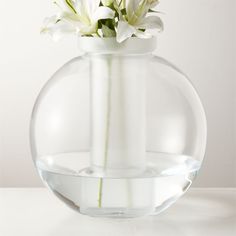 a vase with flowers in it sitting on a table