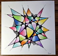 this is an image of a colorful art work on white paper with colored shapes in the middle