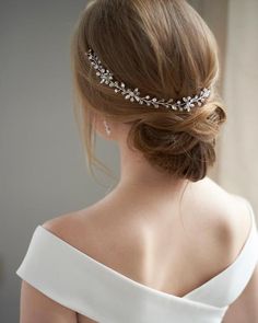 a woman wearing a bridal hair comb