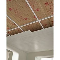 a room with some boxes on the ceiling