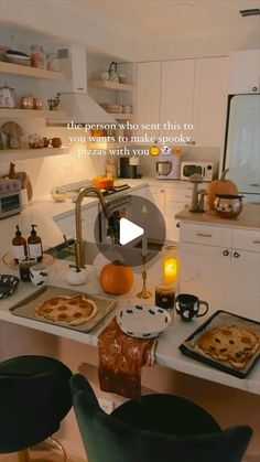 an image of a kitchen setting with pizzas on the counter and candles in the oven