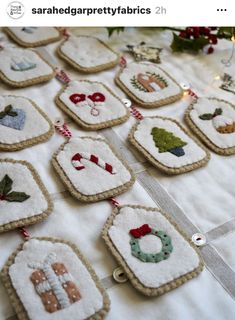 some christmas ornaments are hanging on a table