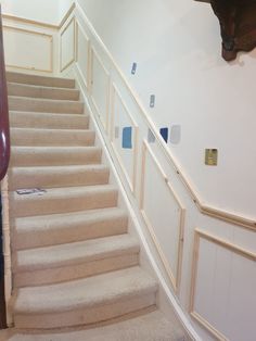 the stairs are painted white with blue squares on them