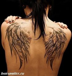 the back of a woman's body with wings on it