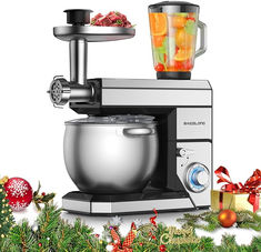 a silver mixer sitting on top of a counter next to christmas decorations and fruit in a bowl