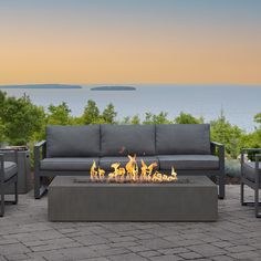 Create your ideal outdoor gathering space with the stylish and versatile design of this gas outdoor fire table. Made in the USA of glass fiber reinforced concrete (GFRC), the Estes Low Rectangle Fire Table has a simplified silhouette and a rustic finish, with a brass burner system that produces rich and inviting flames. Available in either natural gas or propane in a flint or carbon finish. Jensen Co. 60-in W Carbon Portable Glass Fiber Reinforced Concrete Rectangle Propane Gas Fire Pit Table Po Sofa Area Externa, Glass Fiber Reinforced Concrete, Outdoor Gathering Space, Outdoor Fire Table, Natural Gas Fire Pit, Rectangular Fire Pit, Propane Fire Pit Table, Gas Fire Table, Patio Side Table