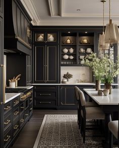 a large kitchen with black cabinets and white counter tops, along with an area rug on the floor