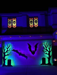 a garage decorated with halloween decorations and lights