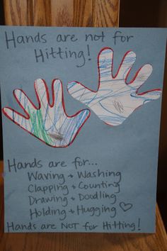 a hand sign with writing on it that says hands are not for hitting or waving