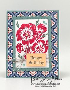 a happy birthday card with red flowers on blue and white cardstocked in orange