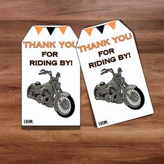 two tags that say thank you for riding by and have an image of a motorcycle on them