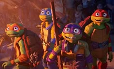 the teenage mutant turtles are walking down the street with their backpacks on and one is holding a baseball bat