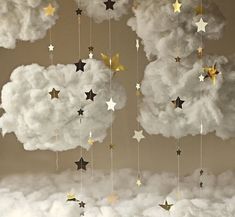 there is a cloud with stars hanging from it