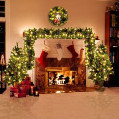 a fireplace decorated for christmas with stockings and stockings