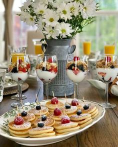 a table topped with lots of desserts and drinks