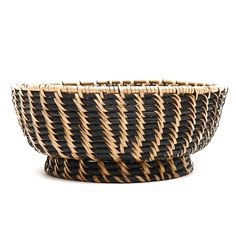 a black and brown basket sitting on top of a table