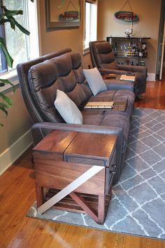 a living room with two couches and a coffee table in the middle of it