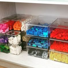 plastic containers filled with legos sitting on top of a counter