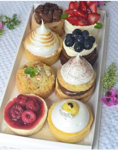 there are many different pastries in the tray