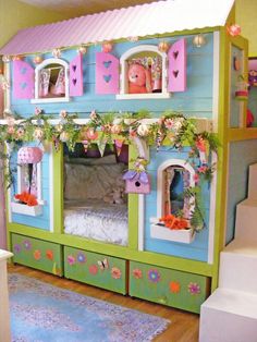 a child's bedroom with a doll house built into the wall and decorated in flowers